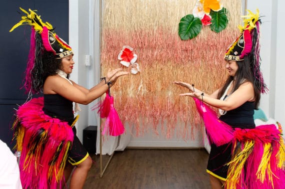 Two hula dancers dancing for Harmony's first birthday party