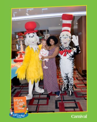 Jocelyn and Harmony posing with Dr. Seuss characters at breakfast onboard the Carnival Horizon