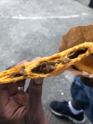 Half eaten Jamaican Beef Patty in Ocho Rios, Jamaica
