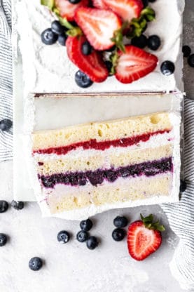 Close up overhead shot of a slice of Berry Icebox Cake topped with fresh berries 