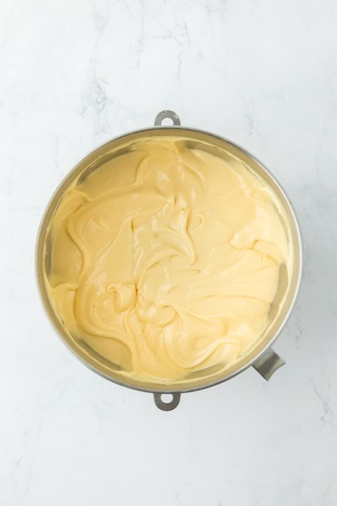 Fully mixed cake batter in the stainless steel mixing bowl, ready to pour