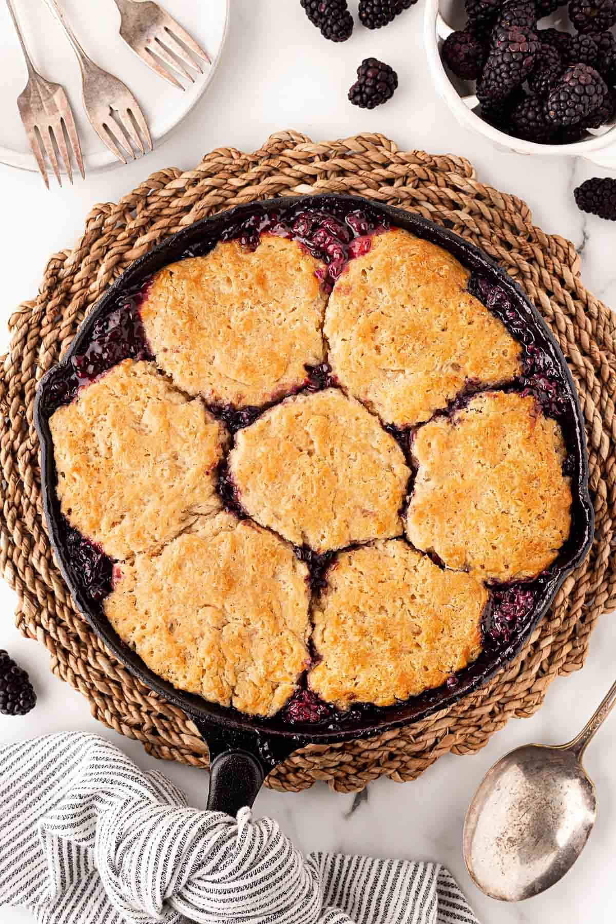 Overhead shot of baked blackberry cobbler in cast iron skillet