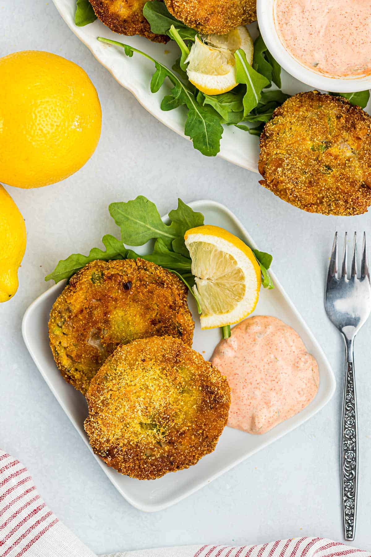 Overhead of two southern salmon croquettes on a plate.