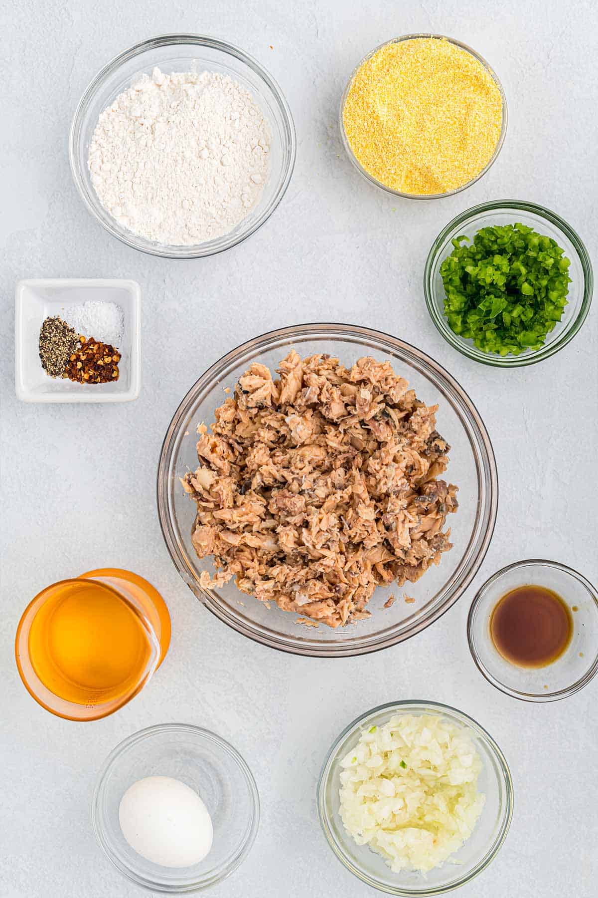 Ingredients to make salmon croquettes on the table.