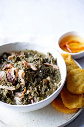 A large bowl of mustard greens recipe with smoked turkey