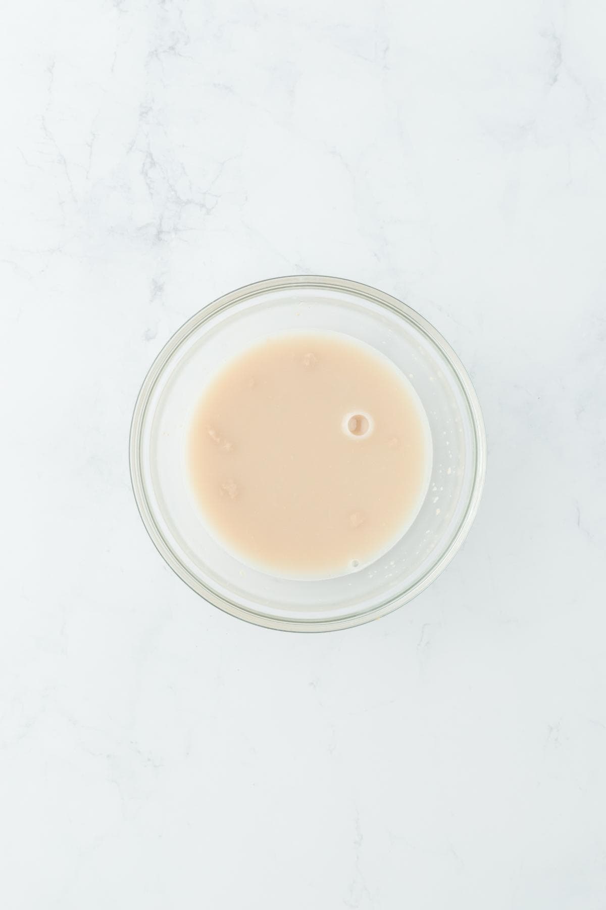 A small glass bowl with proofing yeast