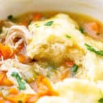 A large pot of homemade chicken and dumplings recipe ready to serve