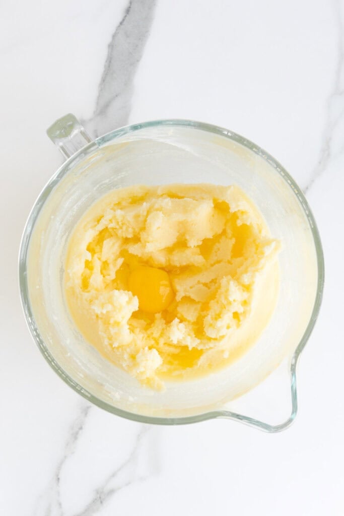 Creamed butter and sugar in a stand mixer bowl with an egg too