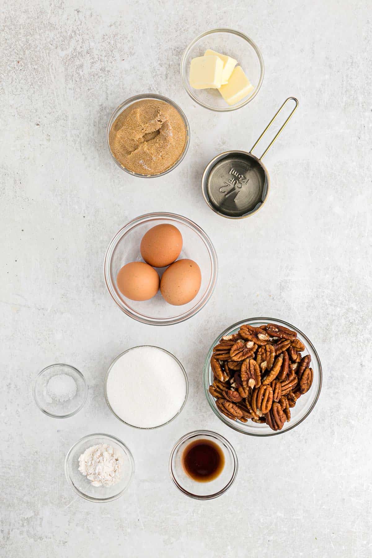 Ingredients to make pecan pie on the counter ready to mix up.