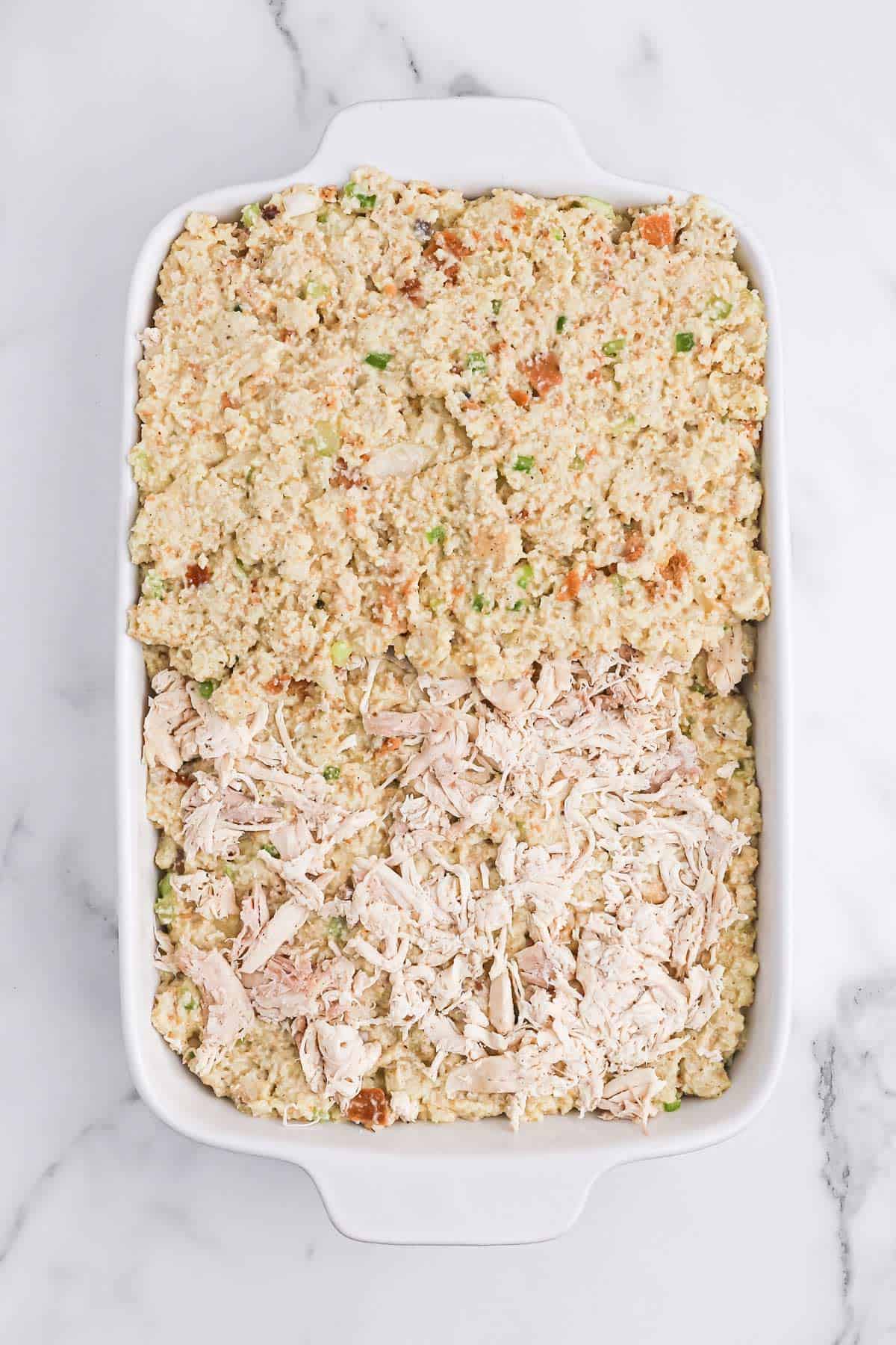 Cornbread stuffing layered with meat in the middle.