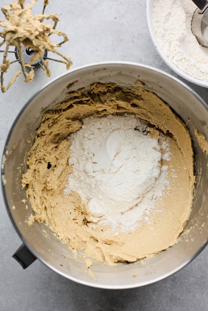 Dry ingredients being added to gluten free cookie dough