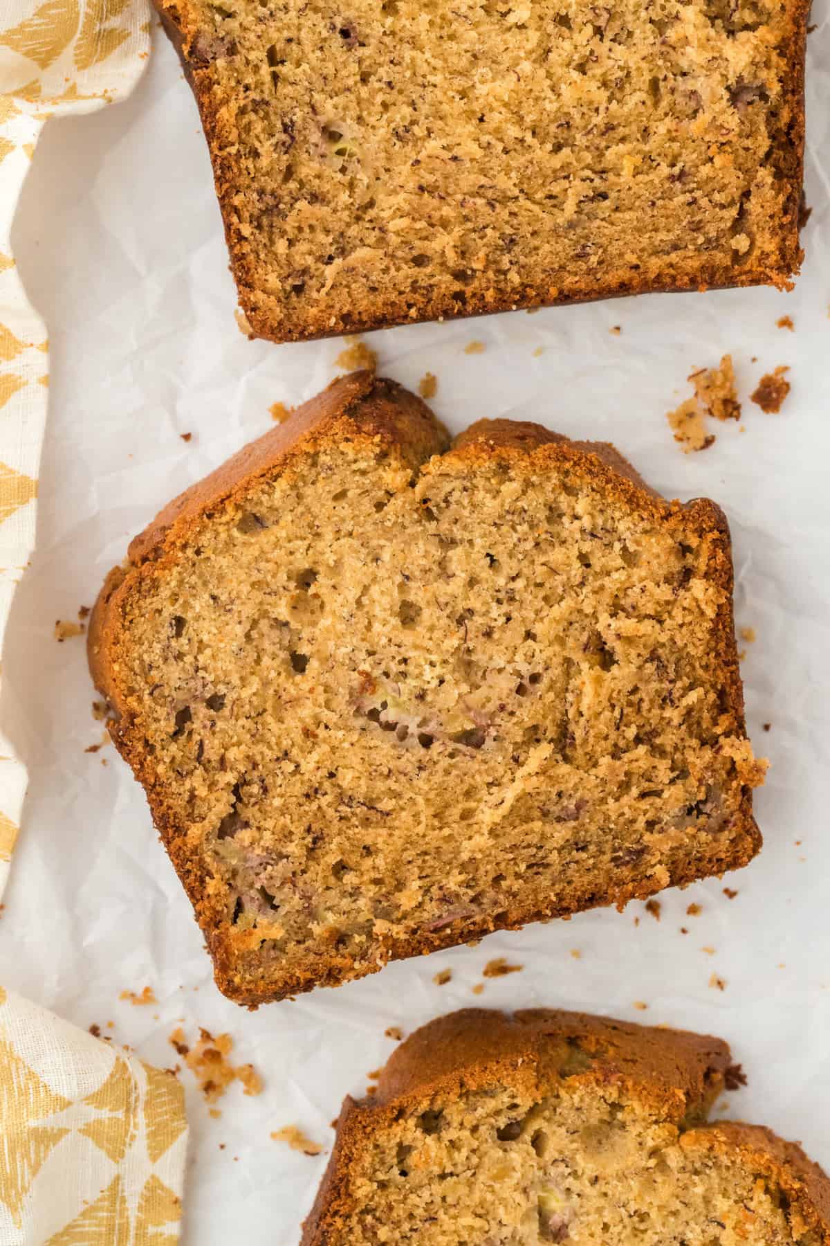 Slices of a simple banana bread on a white background