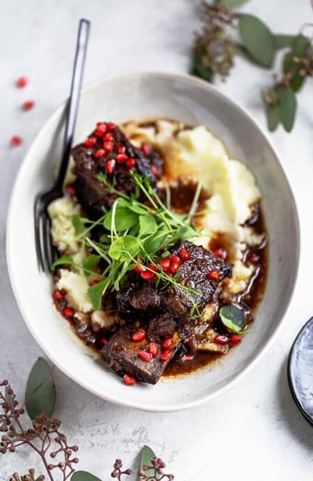 best braised short ribs over mashed potatoes ready to serve for the holidays