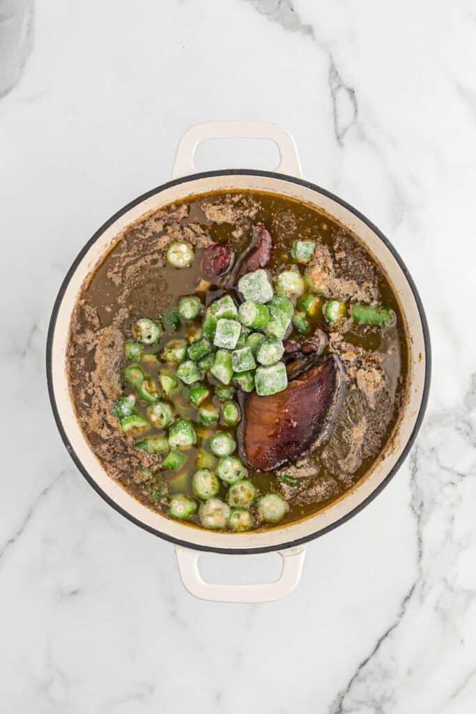 Okra added to the pot of cooked black eye peas.