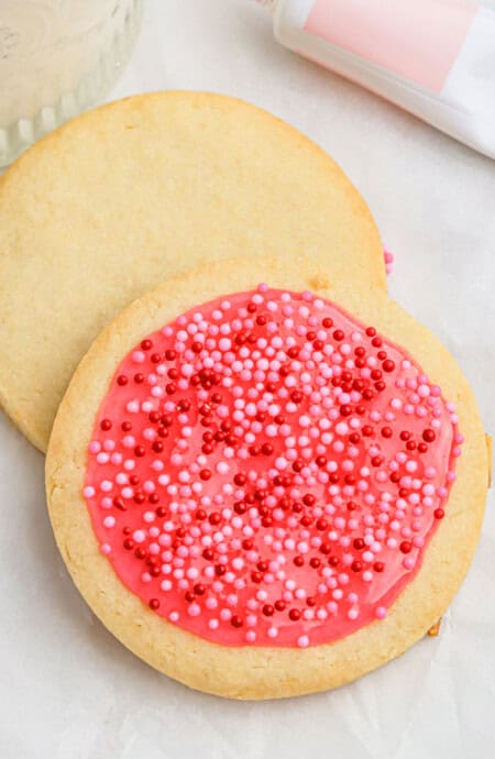 An overhead of iced sugar cookies in amazing shapes with round cookies.