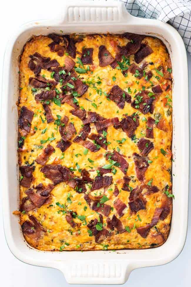 Breakfast bake fresh out of the oven topped with crisp bacon
