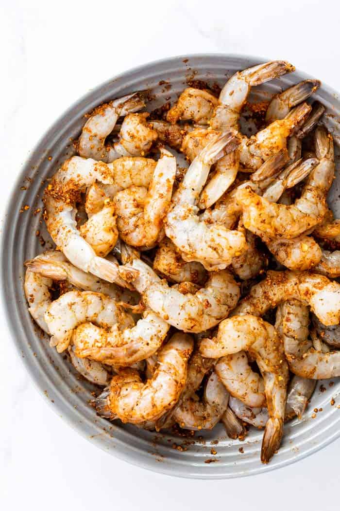 Fresh shrimp tossed in cajun seasoning ready to cook