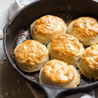 Delicious 7 up biscuits brushed in butter in a cast iron skillet ready to serve