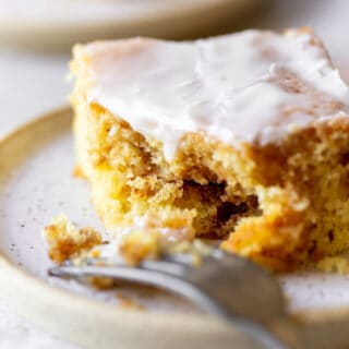 Fork eating a slice of honeybun cake