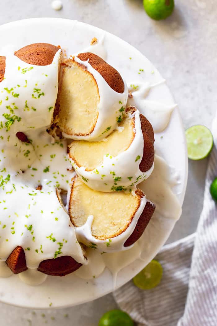 Key lime pound cake slices laying on top of each other ready to serve