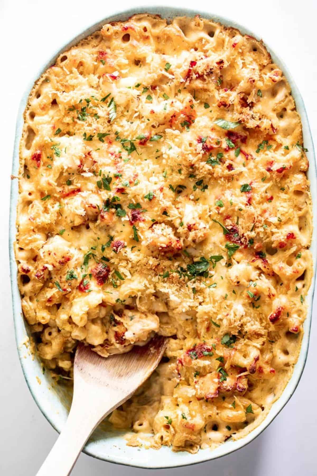A casserole dish of baked lobster macaroni and cheese