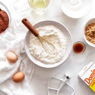 Baking Substitutions ingredients like flour, sugar and eggs scattered around