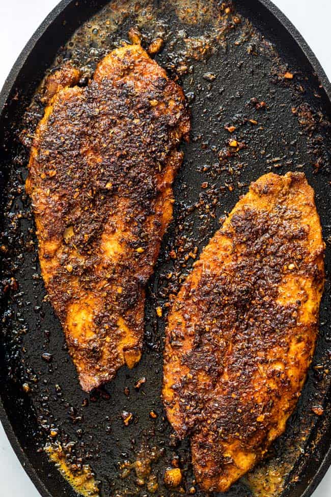 Blackened tilapia in cast iron skillet ready to serve