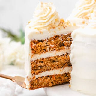 A slice of carrot cake sliding out to serve