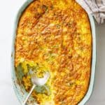 Baked corn spoonbread being served during a meal