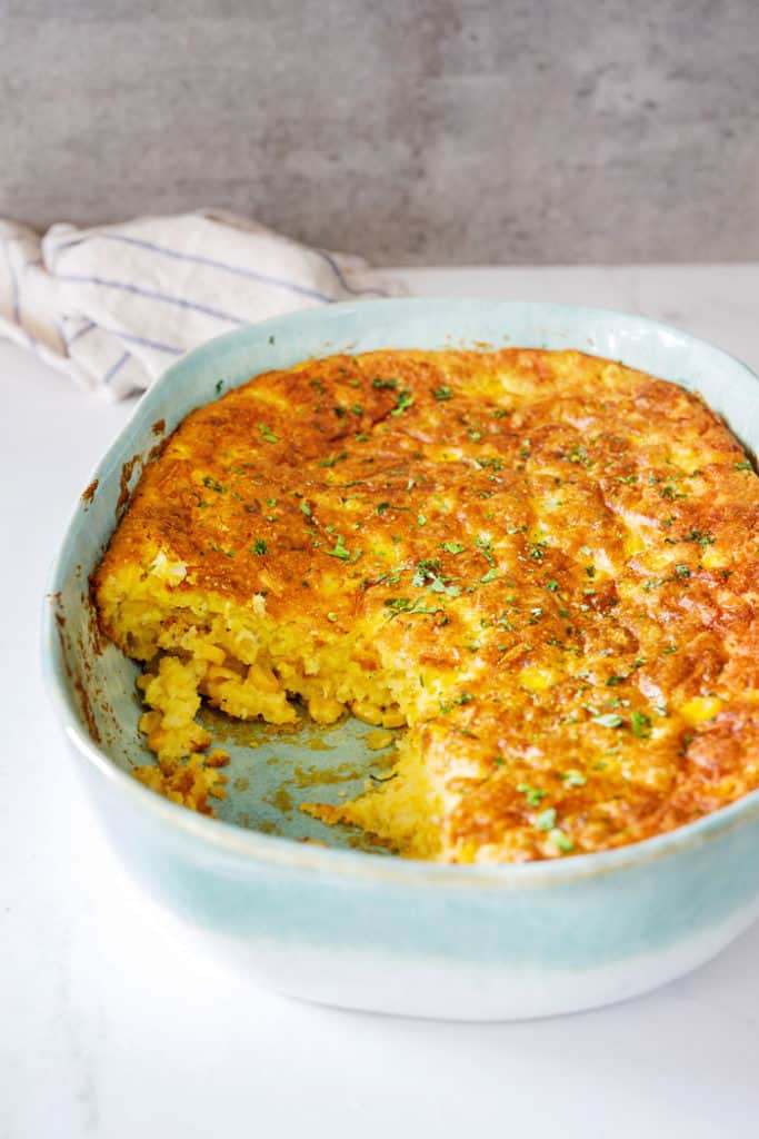 Spoonbread being eaten from casserole dish during dinner
