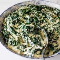 A delicious bowl of perfectly creamed spinach ready to serve with dinner