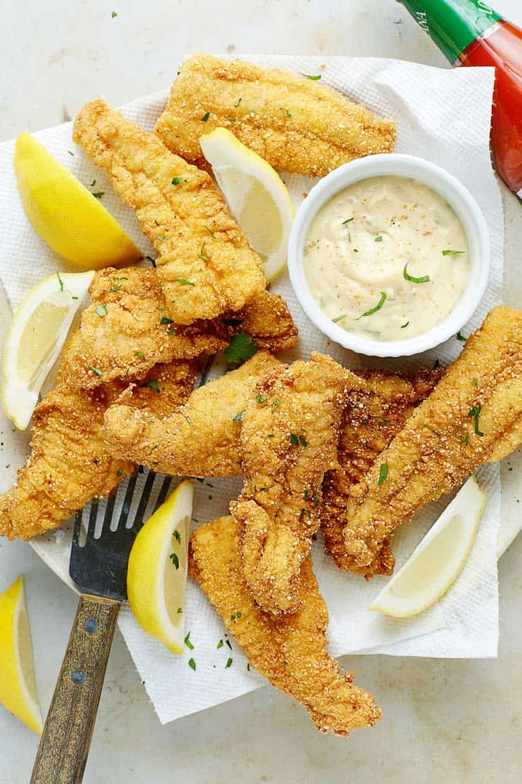 Fried catfish recipe scattered about with tartar sauce
