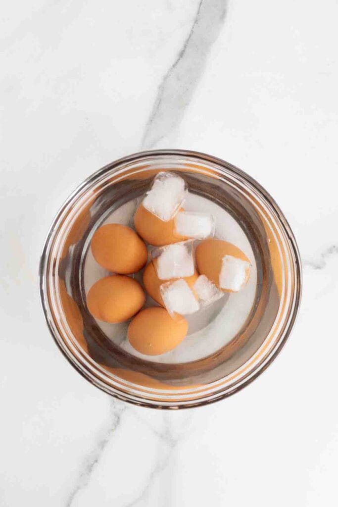 Hard boiled eggs and ice in a large bowl