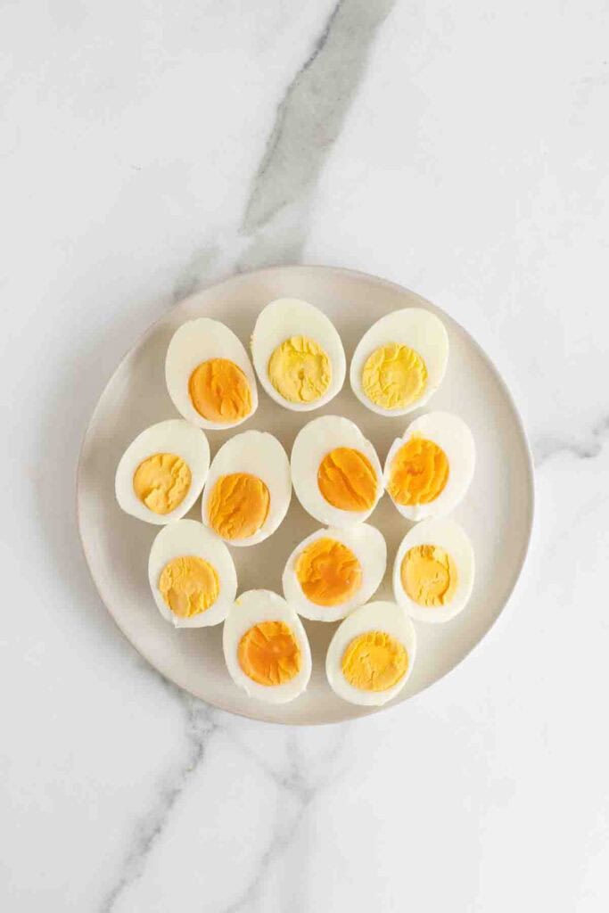 Peeled and halved hard boil eggs on a plate