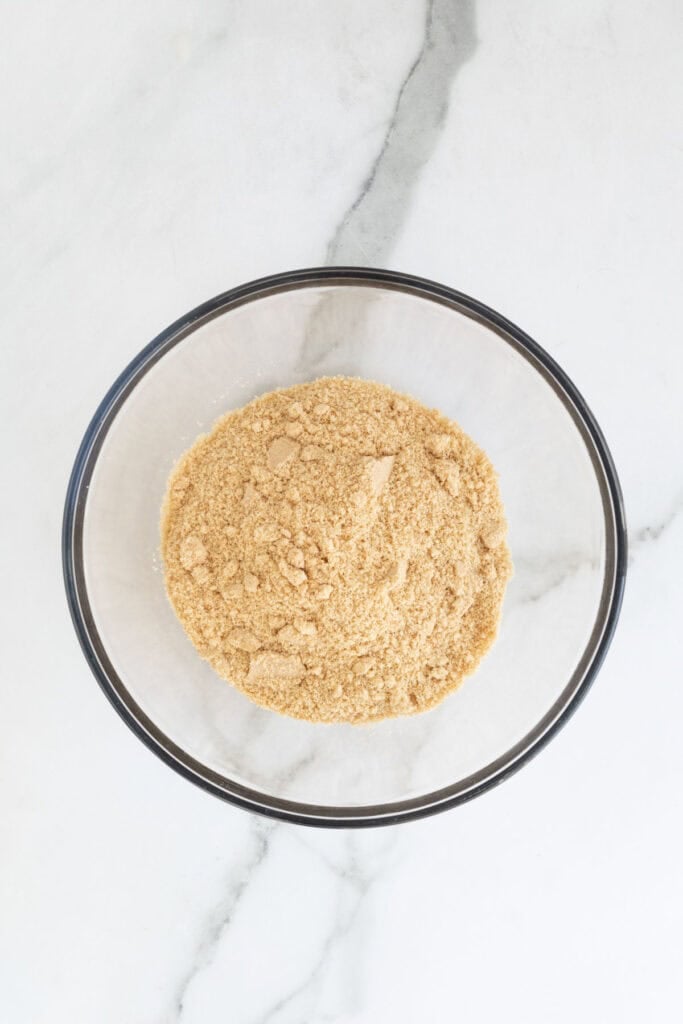 Grinded nilla wafer crumbs in a glass bowl