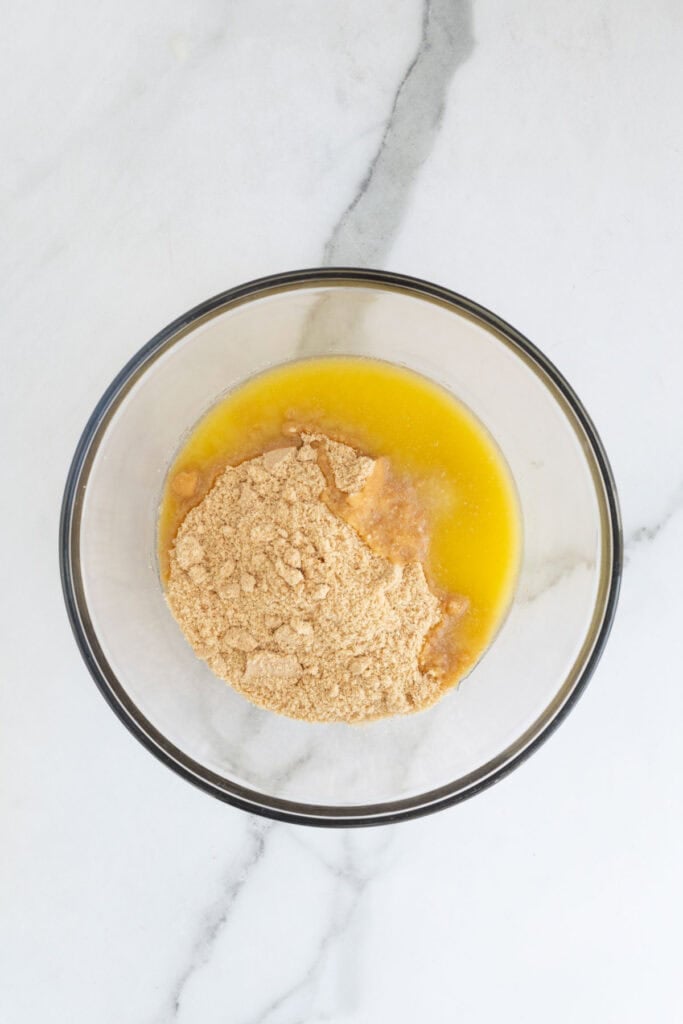 Melted butter poured over crumbled nilla wafers
