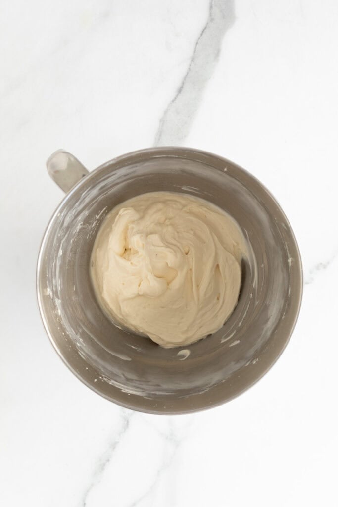Mixed cream cheese batter in stand mixer