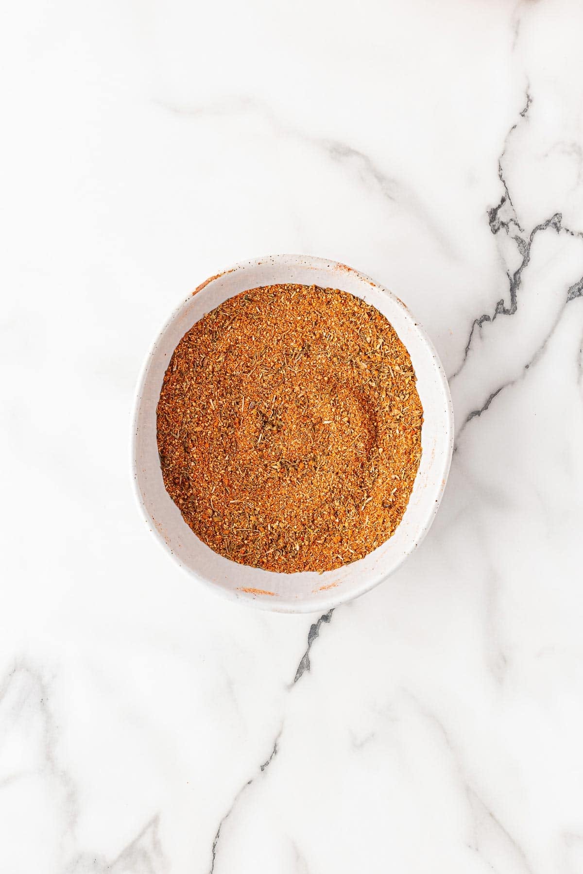 Bowl filled with homemade blackened seasoning blend