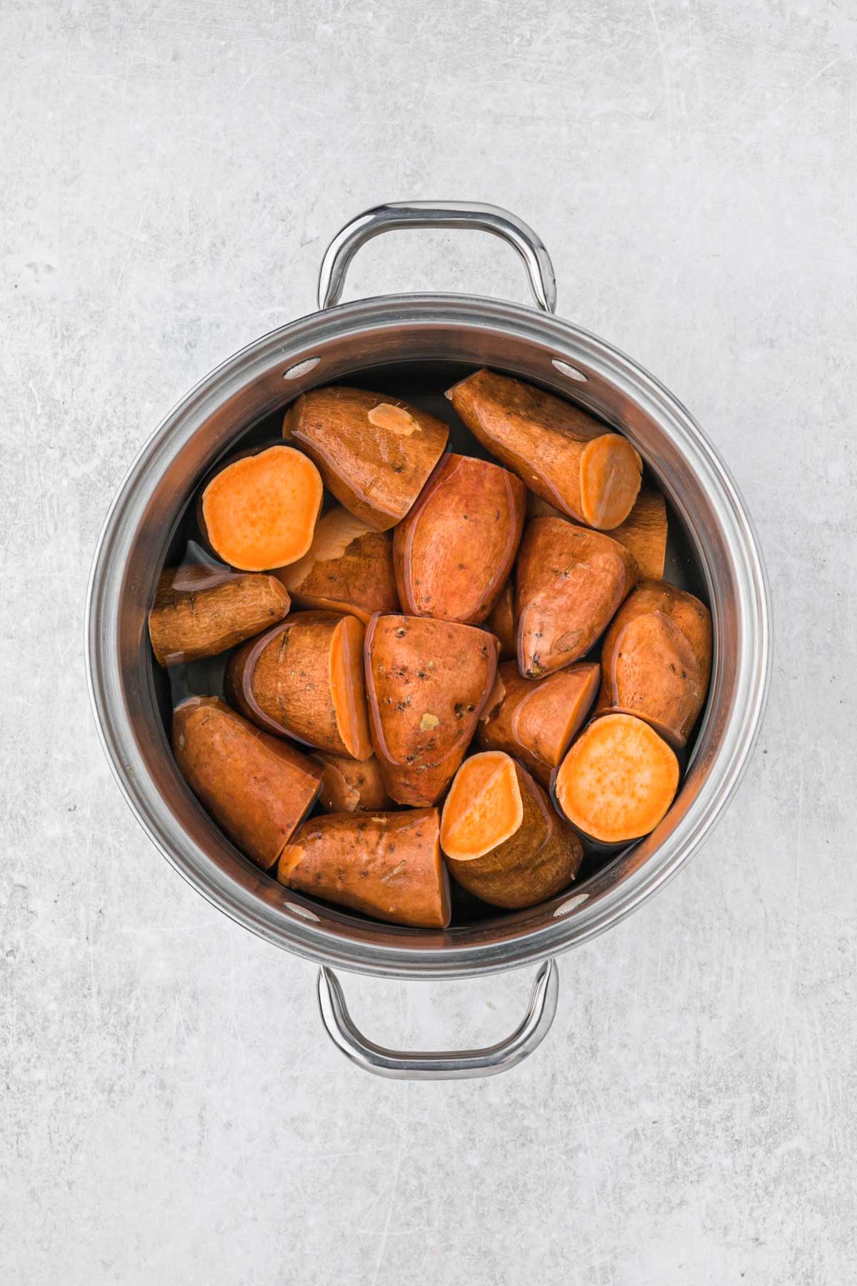 Sweet potatoes in a pot with water.