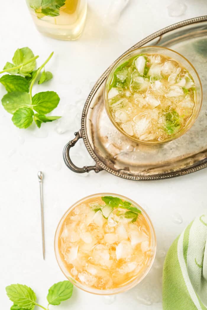 Two mint juleps with crushed ice ready to serve for Kentucky Derby