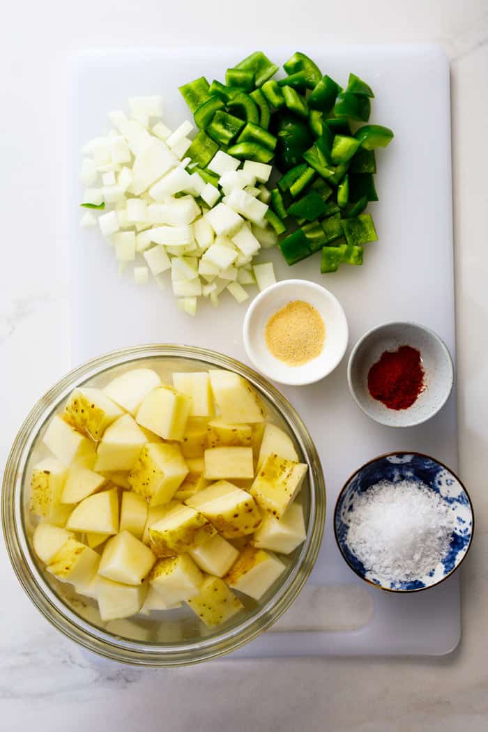 Yukon gold potatoes, onions, peppers, and spices ready to make side dish