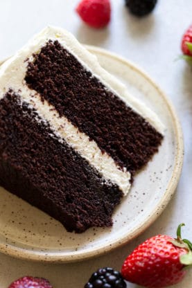 A slice of devil's food cake with buttercream ready to serve