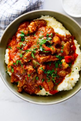 Cajun grillades and grits in a large bowl ready to serve