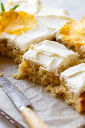 Slices of pineapple sheet cake ready to serve to guests