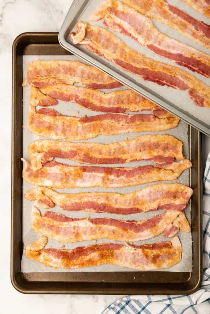 Bacon dipped in sugar mixture and added to sheet pans