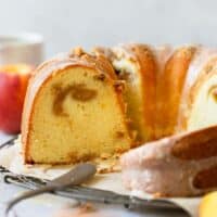 Bundt cake sliced open with peach swirl in the center