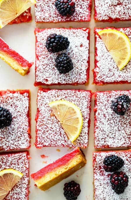 Blackberry lemon bars overhead with lemon bars and blackberries ready to serve