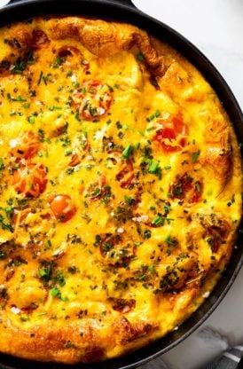 A close up of baked potato frittata coming right out of the oven