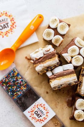 S'more bars surrounded by an ice cream scooper and sprinkles