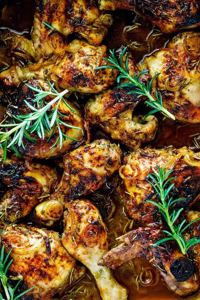 A close up of baked chicken legs and wings after coming out of the oven